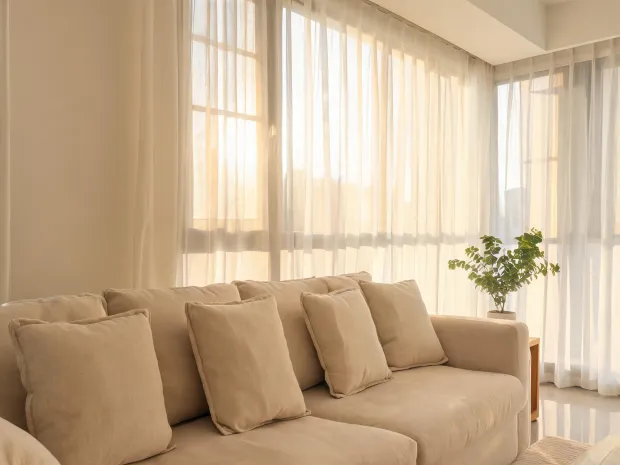Living room with sheer curtains and cushion covers